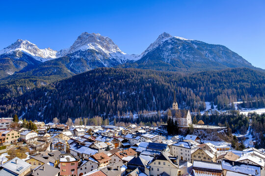 Switzerland, Graubunden Canton, Scuol, View Of Winter Town In Engadine Valley With Mountains In Background