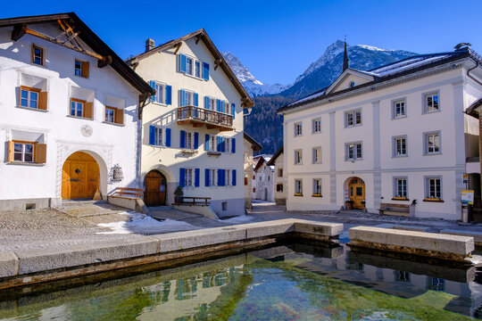 Switzerland, Graubunden Canton, Scuol, Pond in alpine town