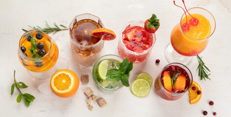 Set of various cocktails with fruits on white background.
