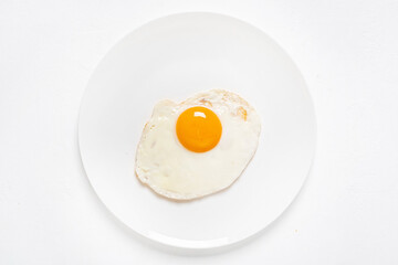 fried egg on the white plate