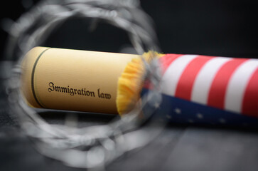 Barbed wire , Immigration Law and flag of United States Of America stock photo