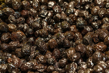 Black olive. Pile of organic olives close-up. food background