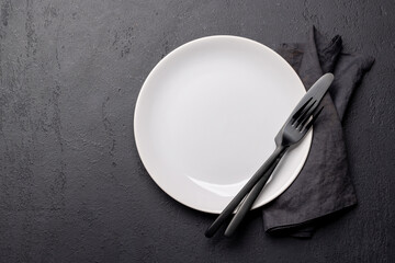 Top-down view of an empty plate and silverware mockup