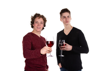 Two young attractive guys are drinking red wine. White background.