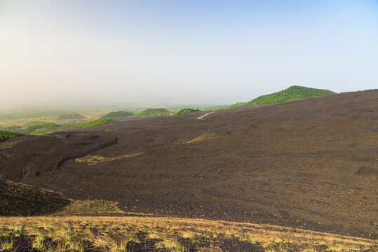 Lunar landscape on Mount Etna. Volcanic ashes and black stone created by eruptions and lava. Silvestri Craters