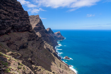 Fototapeta na wymiar View of volcanic cliffs and Atlantic ocean from the lookout terrace Mirador del Balcon on the island of Gran Canaria, Spain. 