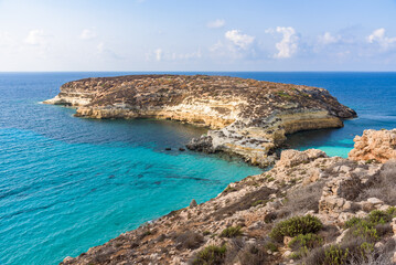 Fototapeta na wymiar Isola dei Conigli (Rabbit Island) and its beautiful beach with turquoise sea water. Lampedusa, Sicily, Italy.