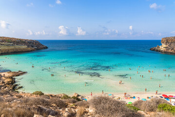 Isola dei Conigli (Rabbit Island) and its beautiful beach with turquoise sea water. Lampedusa, Sicily, Italy. - obrazy, fototapety, plakaty