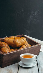 Fresh crispy croissants and a cup of fragrant tea. Breakfast. Morning. customs and culture. Start of the day.