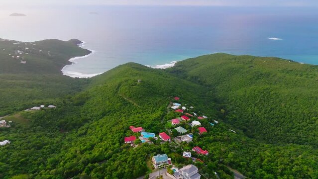 Aerial Establishing Shot Of Houses Built On Top Of A Mountain In St. Thomas, U.S. Virgin Islands