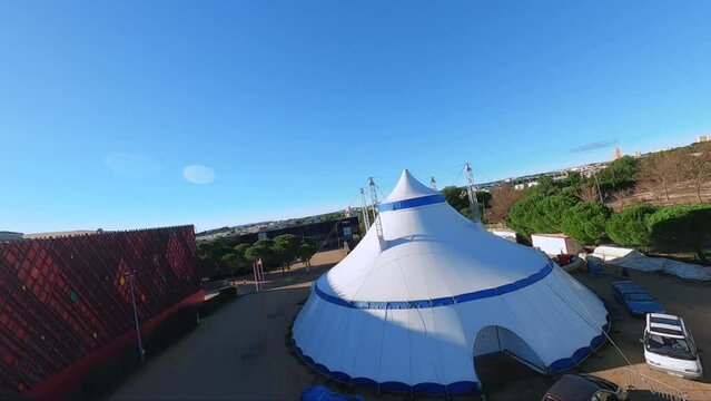 Cinematic FPV Shot Of An Outdoor Event Tent And A Small Concert Stage In France