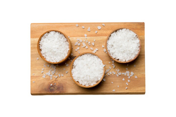 A wooden bowl of salt crystals isolated on white background. Salt in rustic bowls, top view with copy space