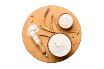 Flat lay of Wheat flour in wooden bowl with wheat spikelets isolated on white background. world wheat crisis
