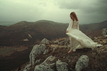 Lone woman on a desolate mountain