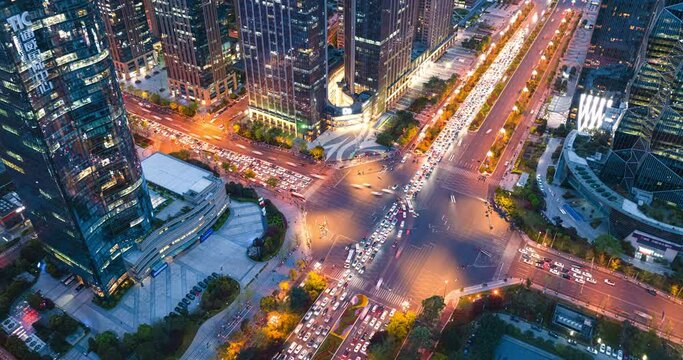 Aerial hyper lapse of Chengdu Cityscape at twilight  with buildings and traffic on the road Chinese word means China Chengdu