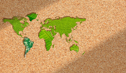 Background of Green Natural plant leaf World Map on brown Recycle plywood sheet made of wood...