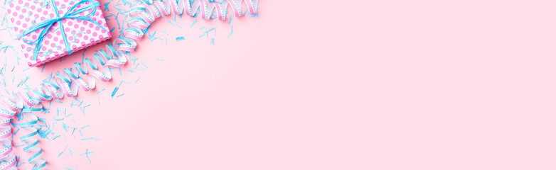 Birthday background with pink dotted gift box, serpentine and confetti