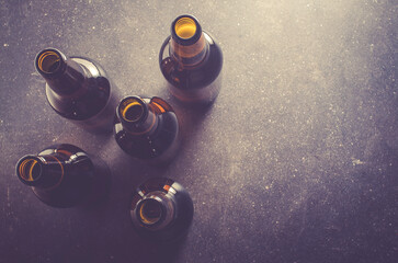 Beer bottles on dark table