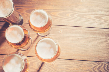 Beer glasses on wooden table