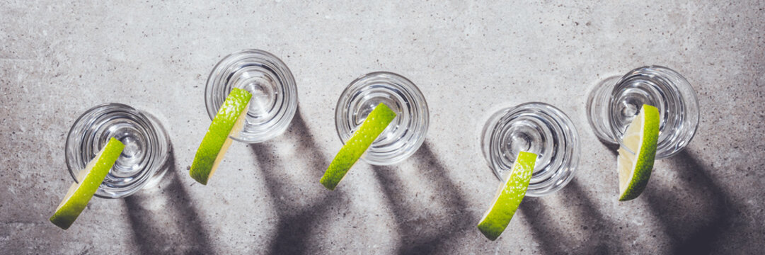 Vodka in shot glasses on stone table