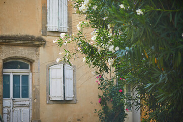 Fototapeta na wymiar Old French house with wooden shutters in Lourmarin, France