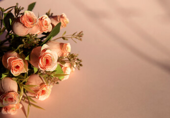 bouquet of roses on pink background, space for text, invintation 