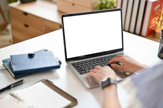 Close-up image of a businesswoman using her laptop. laptop white screen mockup