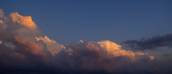 Sunset sky with orange clouds. Nature background.