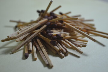 stacks of wooden matches strewn in a mountain range