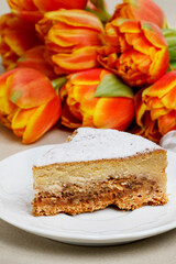 Piece of a cheesecake with nut filling.