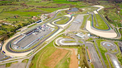 Aerial view of the Vallelunga autodrome, located between Rome and Viterbo, in Italy. The speedway is empty and there are no cars on the circuit. - obrazy, fototapety, plakaty