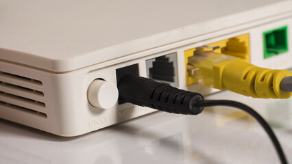 Power button and LAN router ports close-up