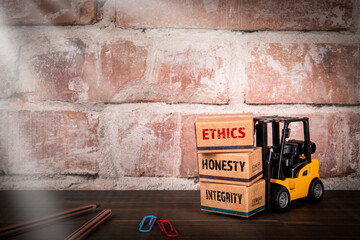 ETHICS, HONESTY and INTEGRITY words on cardboard packaging boxes