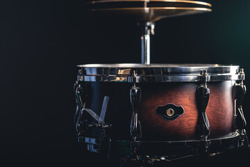 Obraz na płótnie Canvas Beautiful snare drum on a black background, close up.