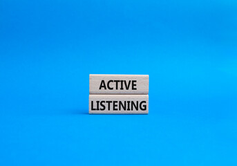 Active listening symbol. Wooden blocks with words Active listening. Beautiful blue background. Business and Active listening concept. Copy space.
