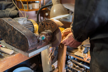 a man cuts iron with a flex. close-up