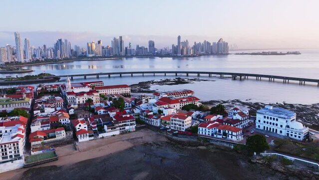 Drone shot of Casco Viejo old town Panama with the Panama City skyline in the back in the morning while backtracking and showing Casco Viejo 