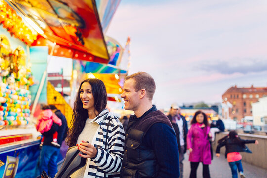 Couple in amusement park during festival
