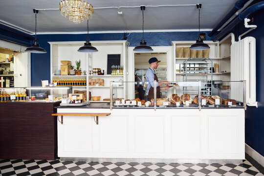 Young owner working in bakery