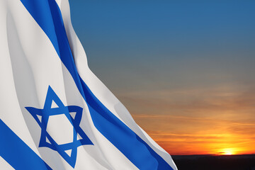 Israel flag with a star of David over cloudy sky background on sunset. Banner with place for text.