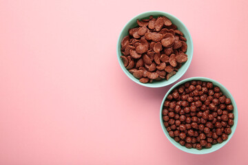 Set of various breakfast cereals on pink background. Vertical photo