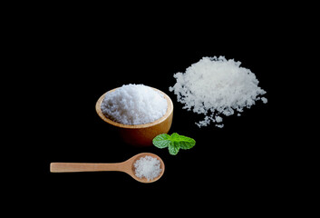 Rock salt in wooden spoons, wooden bowls for condiment design