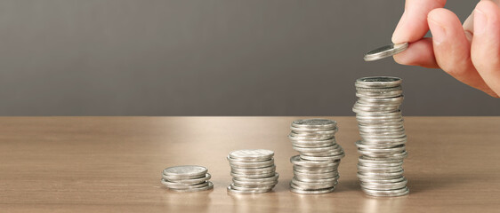 Stack of coin with trading graph, financial investment
