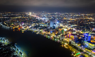 Fototapeta na wymiar Can Tho city, Can Tho, Vietnam at night, aerial view. This is a large city in Mekong Delta, developing infrastructure, population, and agricultural product trading center of Vietnam