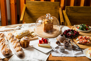 Various desserts, breads and cakes on the table