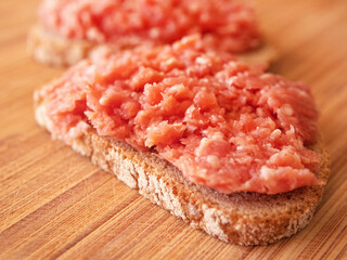 Savor a rustic German snack with Onion Mett served on bread