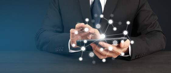 Man holding smartphone device and touching screen
