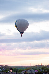 Aerostatics and aeronautics. Airballoon against sky.