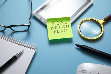 Goal. Action. Plan on sticky note. Business concept