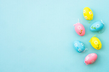 Fototapeta na wymiar Easter eggs on blue background. Flat lay with copy space.